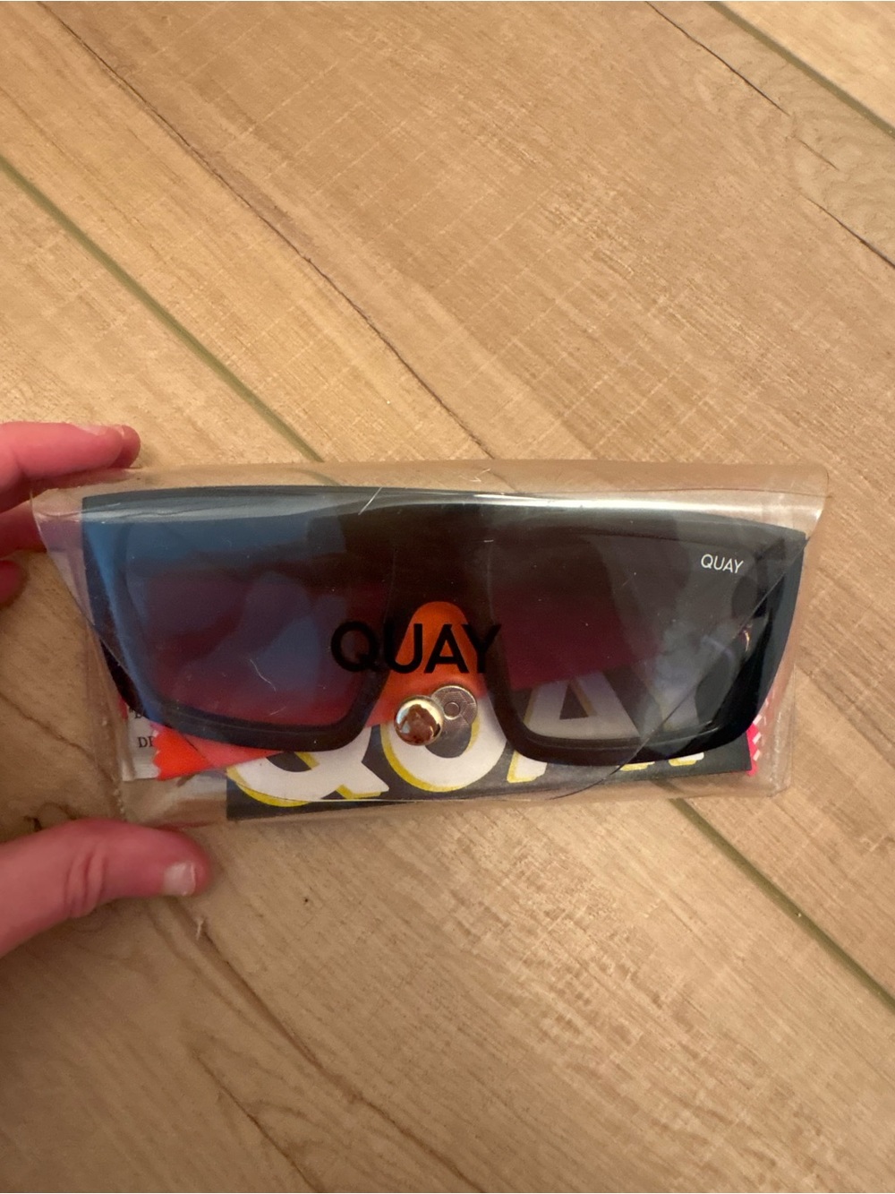 Quay Australia Black Shield Sunglasses with Red-Tinted Lenses